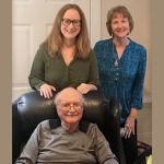 Dr. Stennett seated on chair with Katherine Stennett Rudolph and Stephaie Stennett Ashby