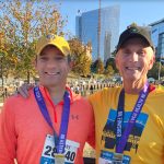 Jim and his son celebrating completion of race